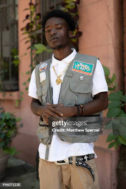 Henry Agyekum is seen on the street attending Men's New York Fashion Week wearing Raf Simons on July 10, 2018 in New York City.
