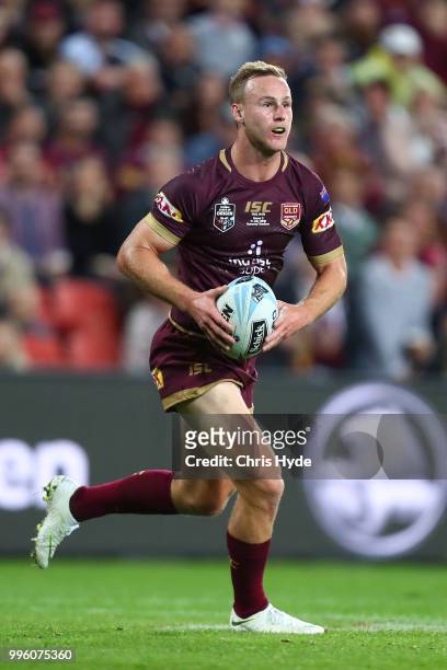 Daly Cherry-Evans of the Maroons runs the ball during game three of the State of Origin series between the Queensland Maroons and the New South Wales...