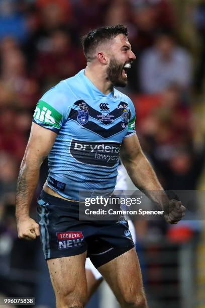 James Tedesco of the Blues celebrates scoring a try during game three of the State of Origin series between the Queensland Maroons and the New South...