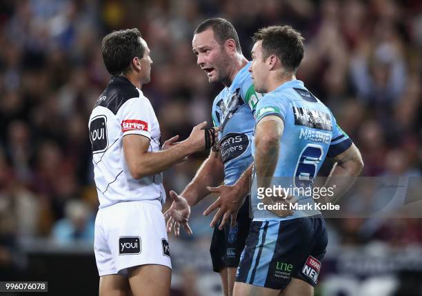 Boyd Cordner and James Maloney of the Blues speak to the referee after Maloney was sent to the sin bin during game three of the State of Origin...