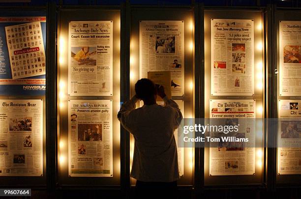 Avery Biles, a D.C. Fifth grader, takes notes from the daily front pages from newspapers from around the world at the Newseum in Rosslyn, Va.