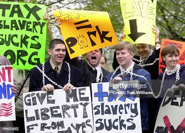 Members of Taxslaverysucks.org cheer for lower taxes at "Tax Freedom Day" rally on the East Frnt Lawn. Members of various organization came together...