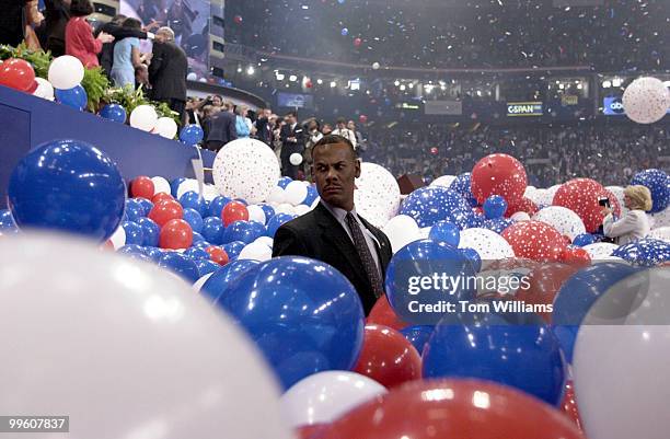 Sceret Service agent gets caught up in the excitement of the baloon drop after Bush's presidential nomination acceptance speech at the republican...