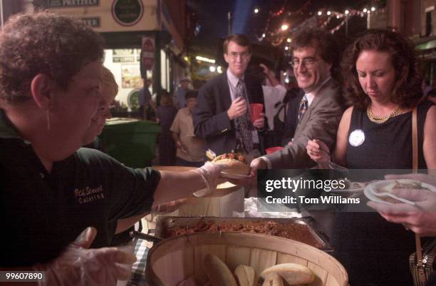 Today's Tom Squitieri gets a meatball sandwich from the 9th Street Caterers at the Italian Market in South Philly. The party was hosted by...