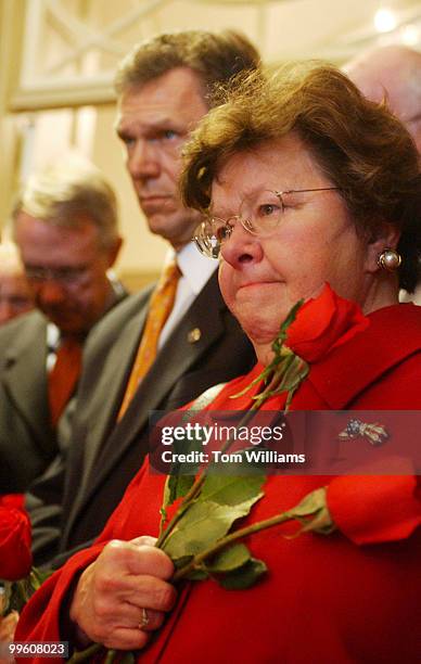 From left Sens. Harry Reid, D-Nev., Tom Daschle, D-S.D., and Barbara Mikulski, D-Md., stand ready to lay roses in memory of Detective John Gibson and...