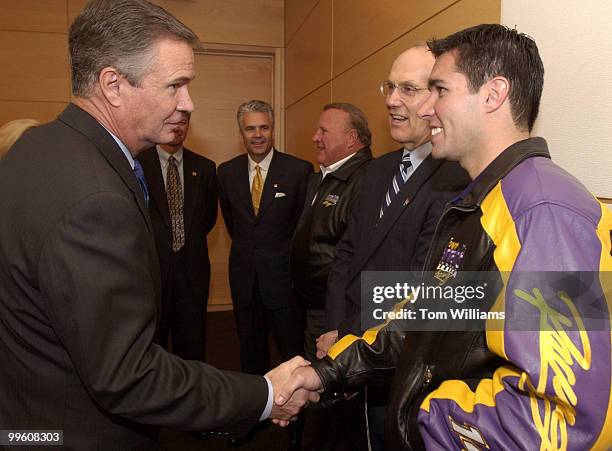 Sen. John Breaux, D-La., greets Larry Foyt of the Nascar Busch Series, Harrah's Racing Team, at an event promoting the Annual March for Meals...