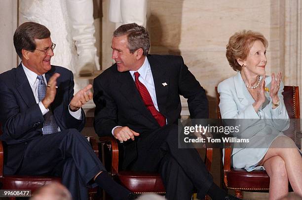 From left, Sen. Trent Lott, R-Miss., President George W. Bush, and Nancy Reagan attend a ceremony in the Rotunda of the Capitol Building to honor...