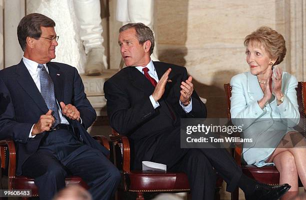 From left, Sen. Trent Lott, R-Miss., President George W. Bush, and Nancy Reagan attend a ceremony in the Rotunda of the Capitol Building to honor...