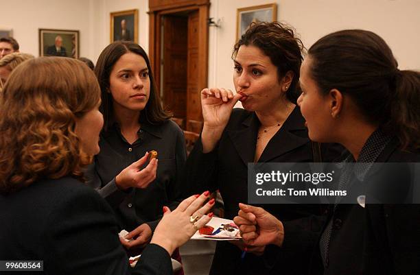 From left, Piper Largent, Julie Philip, Elizabeth Nodel, and Jessie Torres taste test products at the "The Chemistry of Chocolate" event. To mark...