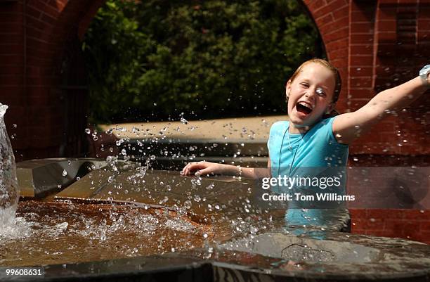 After a long day of visiting Washington, Katie Wade of Vienna, gets hit in a water fight with her cousin, in the Grotto on the West Front of the...
