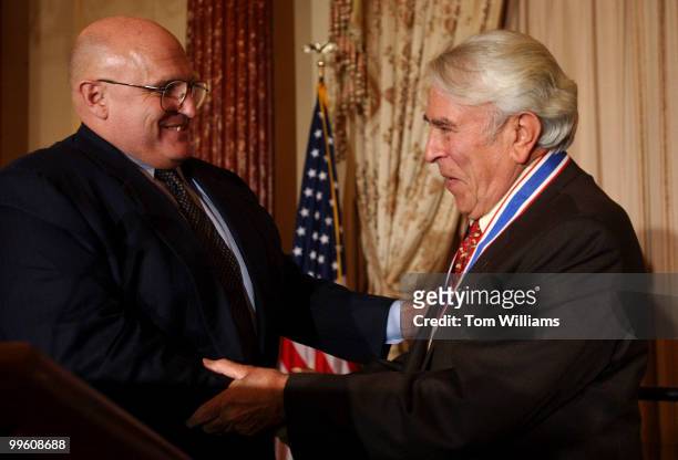 Rep. Ben Gilman, R-N.Y., right, is congratulated by Deputy Secretary of State, Richard Armitage, after accepting The Secretary's Distinguished...
