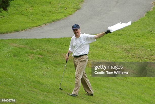 Rep. Mike Ferguson, R-N.J., waves the white flag of surrender to his democratic opponents during the First Tee Congressional Challenge golf...