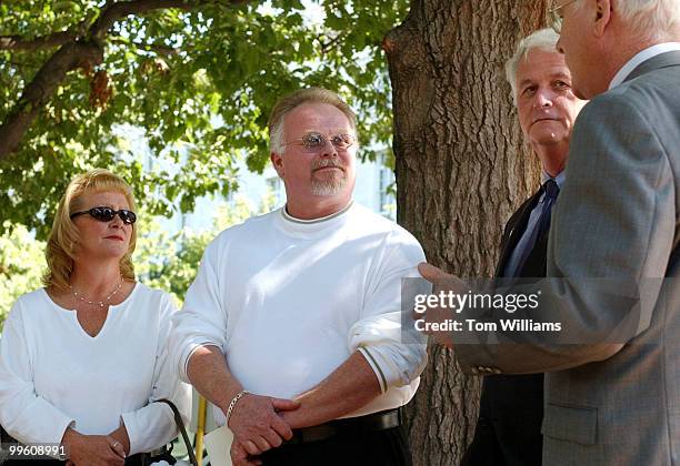 Kirk Bloodsworth and his wife Brenda of Cambridge, Md., talk to Rep. William Delahunt, D-Mass., and Sen. Pat Leahy, D-Vt., before a news conference...