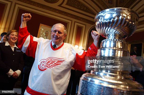 Sen. Carl Levin, D-Mich.,shows off his new Red Wings jersey during a reception for the Stanley Cup and the owners of the 2002 NHL Champion Detroit...