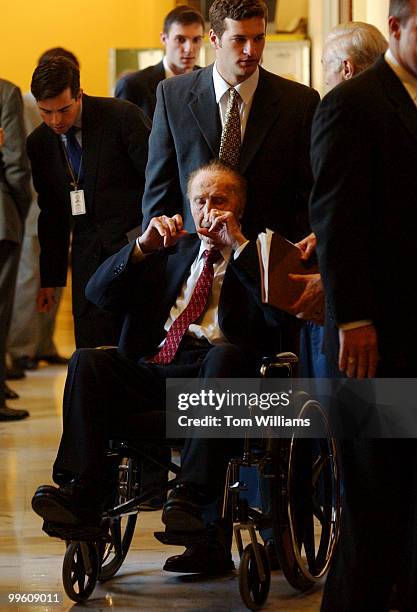 Sen. Strom Thurmond, R-S.C., is wheeled out of the Senate Luncheons.