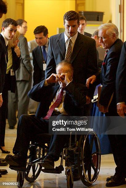 Sen. Strom Thurmond, R-S.C., is wheeled out of the Senate Luncheons.