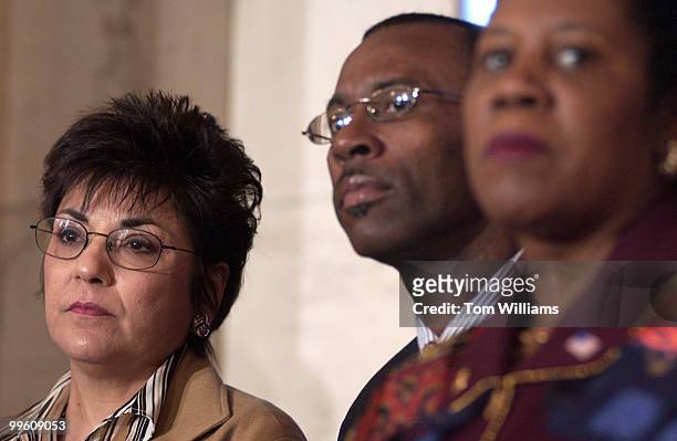 Former Enron employees from left are Debbie Perrotta and Louis Allen who appear at press conference with Rep. Shelia Jackson-Lee, D-Texas, and other...