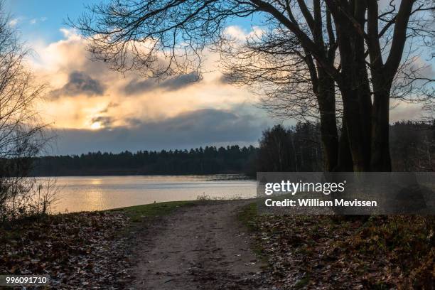 cloudy sunrise - william mevissen stock pictures, royalty-free photos & images