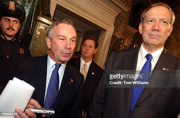 At left, newly elected mayor of New York City, Mike Bloomberg and Governor of the State George Pataki, talk to the press in Statuary Hall after...
