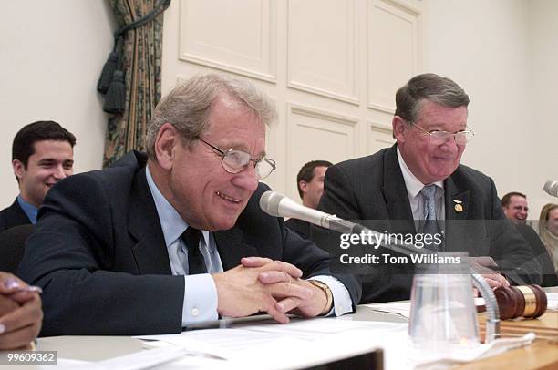 Reps. Ralph Regula, R-Ohio, and Randy "Duke" Cunningham, R-Calif., listen to testimony of Elmo, from "Sesame Street", during the furry monster's...