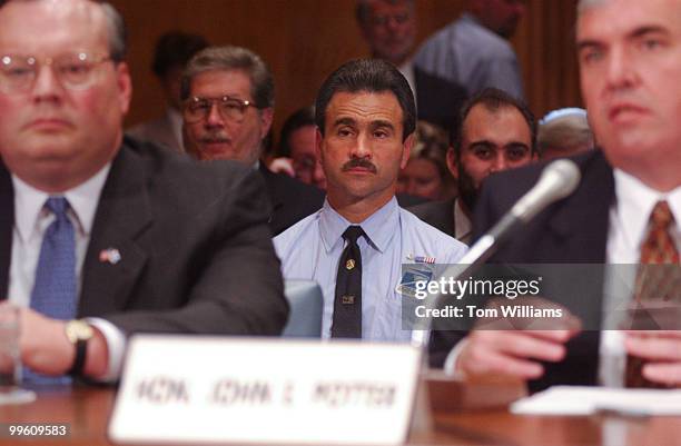 At right, Postmaster General John Potter, U.S. Postal Service , testifies at a hearing with Tom Day, Engineering, USPS, while Tony DiStephano Jr.,...