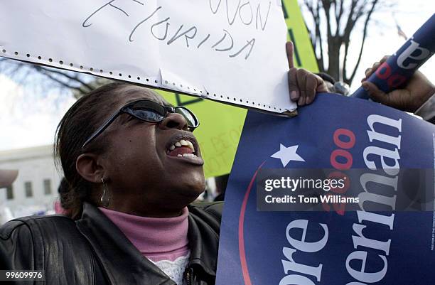 Gore supporter Brenda Scott of Maryland yells at Bush supporters in front of the Supreme Court during the Vice President's appeal.