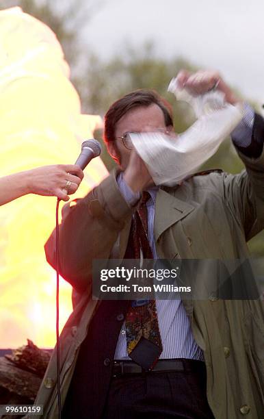 John Welsh of Cleveland Park tears up a tax form at the "Bonfire of the 1040's" Tax Day Demonstration, in which DC tax payers protested the fact that...