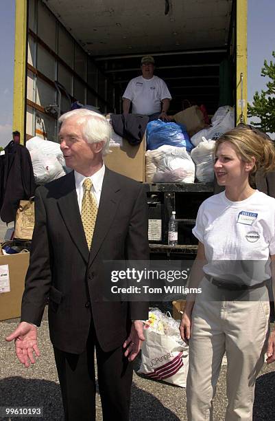 Sen. Thad Cochran, R-MS, and Luanne Griffin of Nissan stand in front of a truck loaded with donated clothing of House and Senate offices after the...