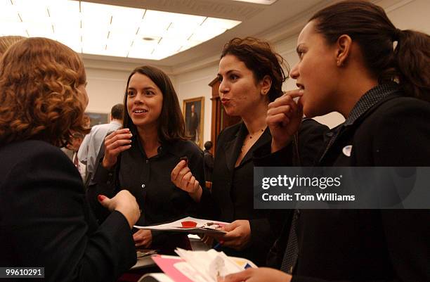 From left, Piper Largent, Julie Philip, Elizabeth Nodel, and Jessie Torres taste test products at the "The Chemistry of Chocolate" event. To mark...