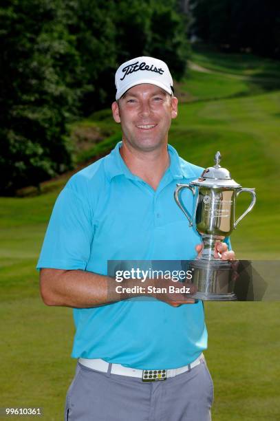 Justin Hicks holds the winner's trophy after the final round of the BMW Charity Pro-Am presented by SYNNEX Corporation at the Thornblade Club on May...