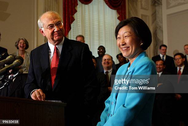 Sen. Phil Gramm, R-Texas, alongside his wife Wendy Lee Gramm, announces that he will retire when his term in the Senate is up in 15 months, Tuesday...
