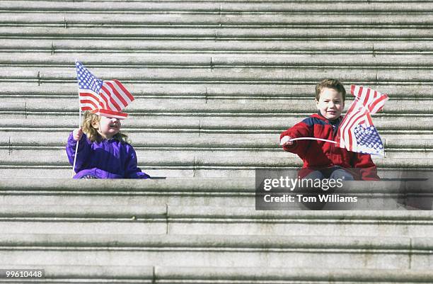 Year old Lily Kidd and brother Timmy sit on the East Front steps of the Capitol before at a press conference in which House Republicans pointed out...