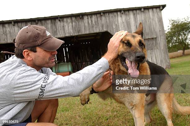 Capitol Police Dog, Fanto, plays with his handler Techinician Shawn Haynes, near their Waldorf, Md. Home. The 11 year old German Shepard was forced...