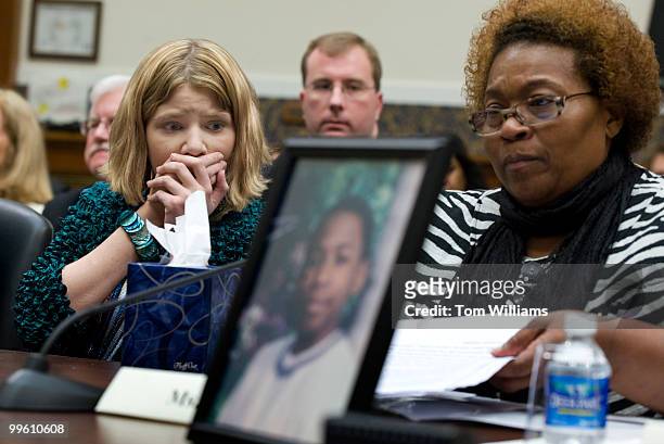 During a House Education and Labor Committee hearing Paige Gaydos listens to testimony from Toni Price whose foster son Cedric was killed while being...