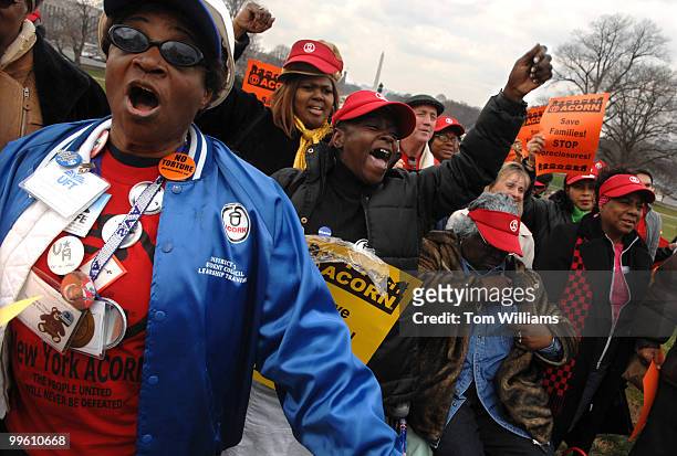 Jeanie Theophile-Floyd, left, and Denis Duncan-Bey, center, members of ACORN attend a rally in support of the Foreclosure Prevention Act. ACORN is...