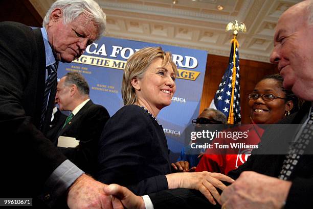 Sen. Hillary Clinton, D-N.Y., greets John Sweeney, president of the AFL/CIO, after a rally at which activists from six states that passed minimum...