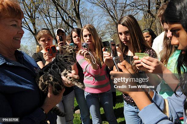 Students take pictures of a Clouded Leopard from the Columbus Zoo after a rally in support of No Child Left Inside Act, an initiative to strengthen...