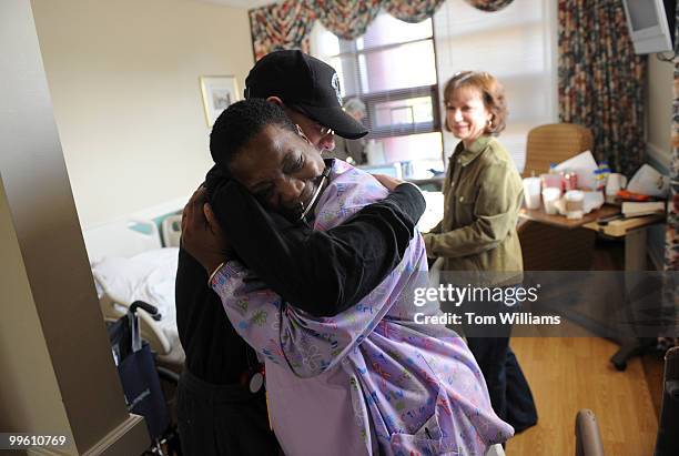 Lorraine Stewart hugs Aidan Sims of the U.S. Capitol Police, at the National Rehabilitation Hospital on the day he was released from in-patient...