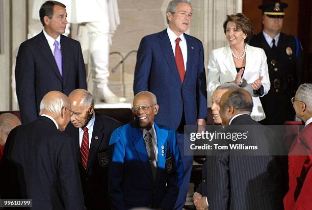 Tuskegee Airmen arrive in the Capitol Rotunda before a Congressional Gold Medal ceremony honoring the black aviators who fought in WWII. In the...