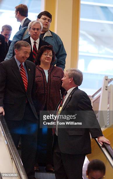 Rep-elect Geoff Davis, R-Kentucky, and his wife ???, talk with Robert Ney, R-OH., on the escalator at Reagan National Airport. Ney was there to meet...