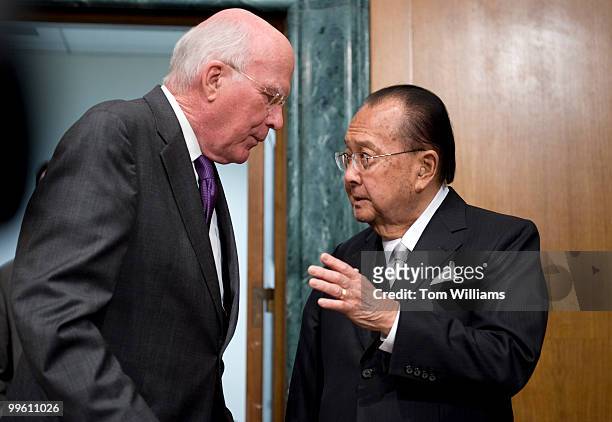 Sens. Pat Leahy, D-Vt., left, confers with Chairman of the Senate Appropriations Committee Daniel Inouye, D-Hawaii, before a hearing to review the...