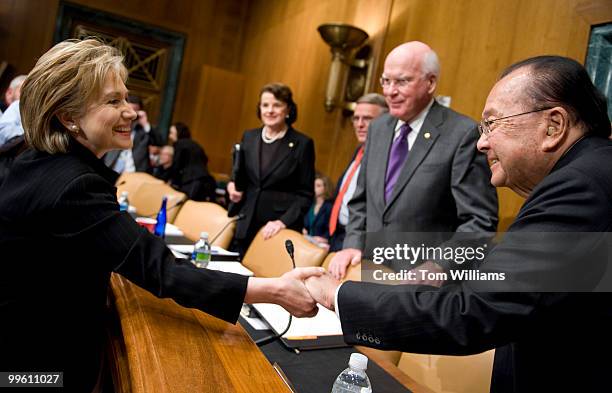 Chairman of the Senate Appropriations Committee Daniel Inouye, D-Hawaii, greets Secretary of State Hillary Clinton before a hearing to review the...