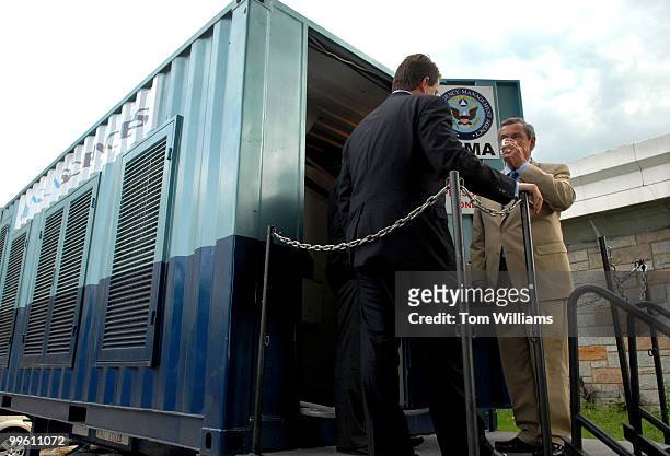 Rep. Clay Shaw, R-Fla., sips a cup of water produced by Aqua Sciences' 20 foot machine which is capable of producing 600 gallons of water a day....