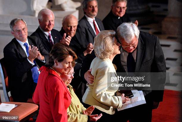 Former Congresswoman Lindy Boggs, D-La., gets a hug from Speaker Dennis Hastert, R-Ill., after receiving the Distinguished Service Award for her...