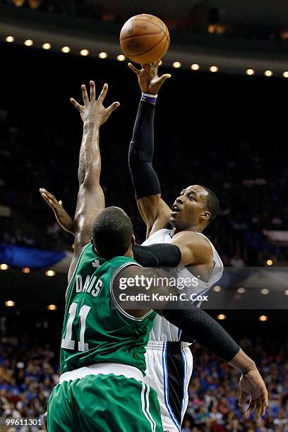 Dwight Howard of the Orlando Magic attempts a shot against Glen Davis of the Boston Celtics in Game One of the Eastern Conference Finals during the...