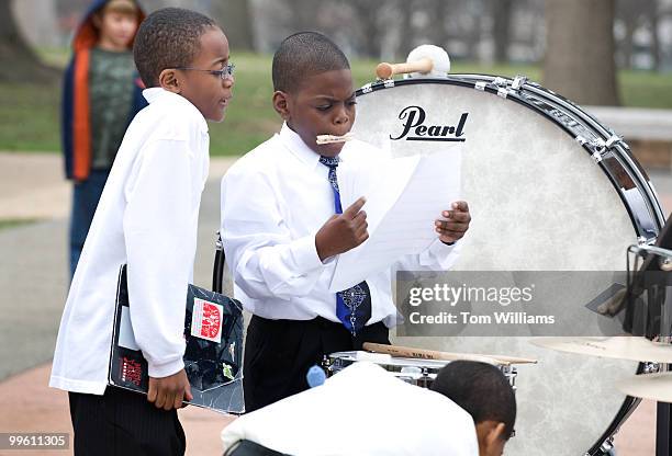 The percussion section of the W.G. Pearson G.T. Magnet Elementary School, Durham, N.C., finds sheet music for their next number during a performance...