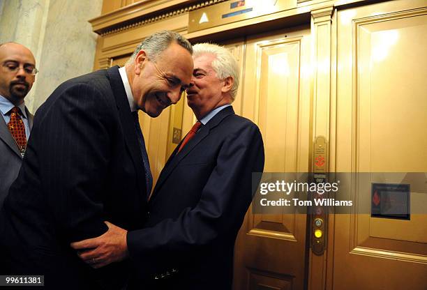 Senate Banking Committee Chairman Chris Dodd, D-Conn., right, and Sen. Charles Schumer, D-N.Y., leave a news conference where a bipartisan group of...