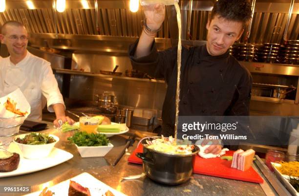 Chef Bart Vandaele prepares a mussels dish at Belga Cafe on 8th St., SE.