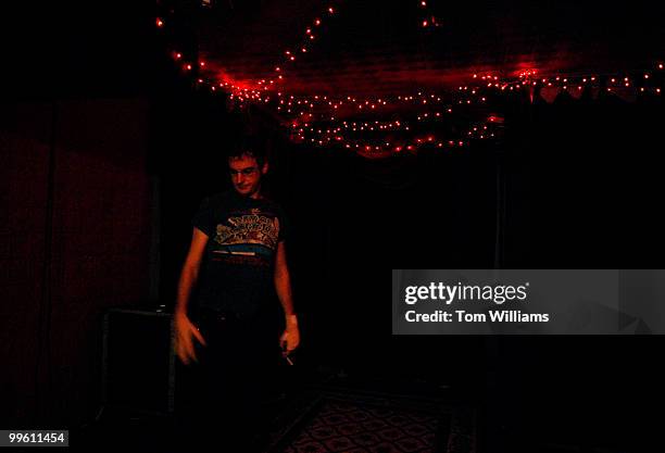 Matt Brown, manager of The Red and the Black on H Street, NE, readies the upstairs bar where musical performances are held.