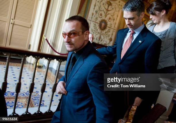 Singer Bono makes his way through the Capitol while on the Hill to talk about the One Campaign, March 31, 2009.